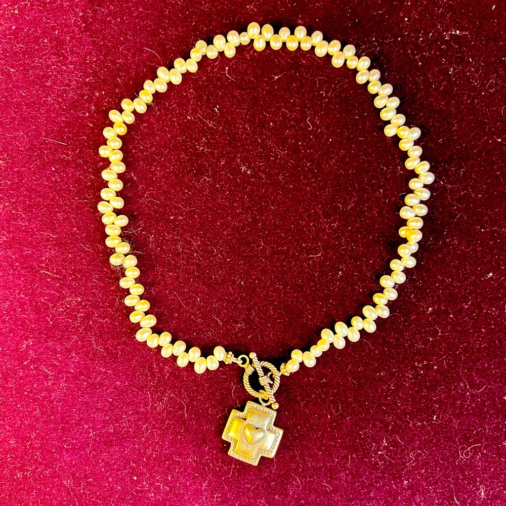 Freshwater pearl necklace with sterling silver accent.